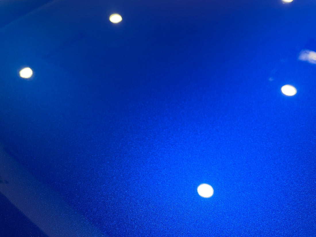 Velocity Blue Range Rover SVR paint after correction, showing metallic detail and reflected overhead lights.