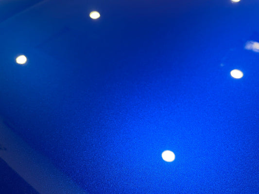 Velocity Blue Range Rover SVR paint after correction, showing metallic detail and reflected overhead lights.